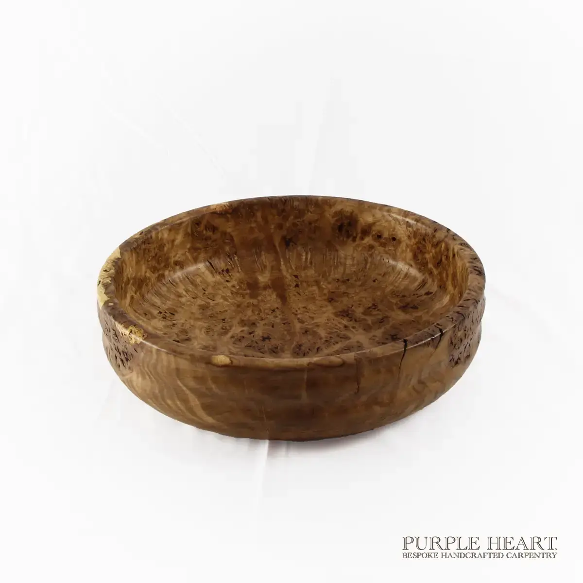 Handcrafted rare burr elm wood bowl with swirling grain and rich golden-brown natural wood patterns