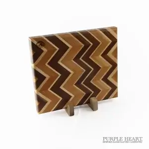 Handcrafted ash, cherry, maple and walnut chevron wooden chopping board with geometric hardwood pattern