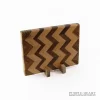 Handcrafted beech, walnut and zebrawood chevron wooden chopping board with geometric hardwood pattern