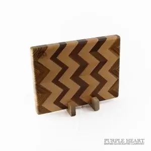 Handcrafted beech, walnut and zebrawood chevron wooden chopping board with geometric hardwood pattern