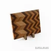 Handcrafted ash, beech and walnut chevron wooden chopping board with geometric hardwood pattern