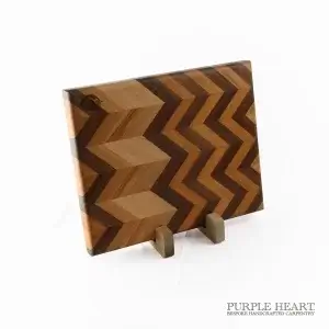 Handcrafted ash, beech and walnut chevron wooden chopping board with geometric hardwood pattern