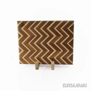 Handcrafted ash and walnut chevron wooden chopping board with geometric zigzag hardwood pattern
