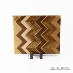Handcrafted ash, cherry, walnut and zebra wood chevron wooden chopping board with geometric hardwood pattern