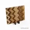 Handcrafted ash, cherry, beech, walnut and zebra wood chopping board with geometric hardwood pattern