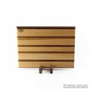 Handcrafted cherry and walnut striped wooden chopping board with contrasting hardwood design