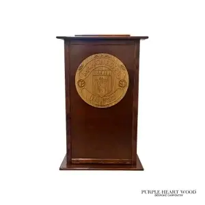 Handcrafted bespoke wooden pedestal lectern with engraved crest detail and polished hardwood finish